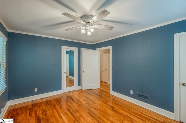 unfurnished bedroom with light wood-type flooring, ceiling fan, and crown molding