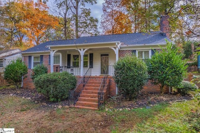 ranch-style home featuring a porch