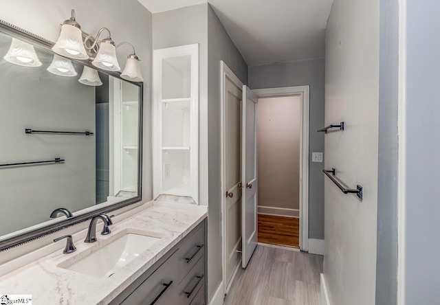 bathroom featuring vanity and hardwood / wood-style floors