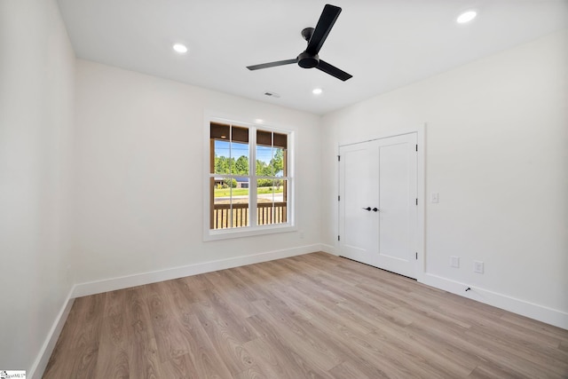 unfurnished bedroom featuring a closet, ceiling fan, and light hardwood / wood-style floors