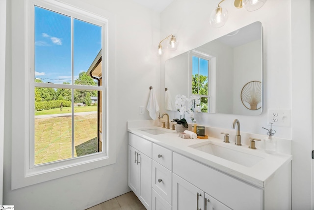 bathroom with vanity and plenty of natural light