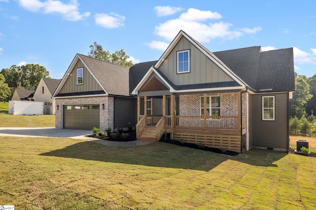 craftsman-style home featuring a garage, a porch, and a front yard