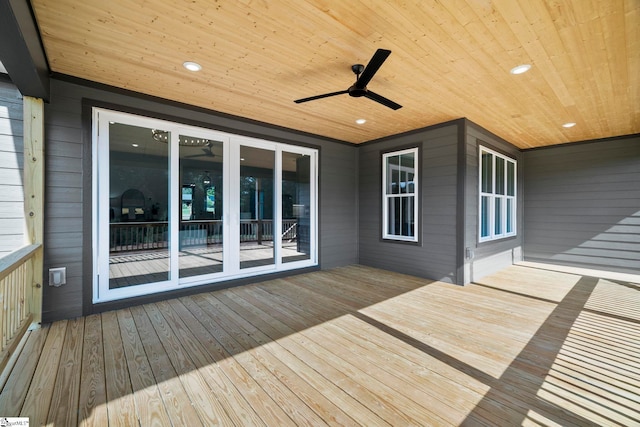 wooden terrace featuring ceiling fan