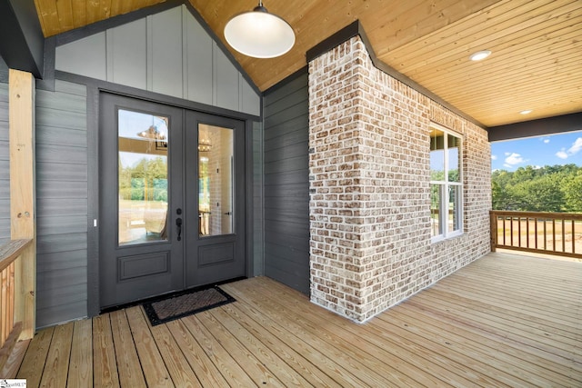 property entrance with french doors and a wooden deck