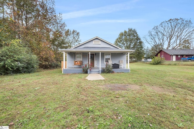 bungalow featuring a front yard and a porch