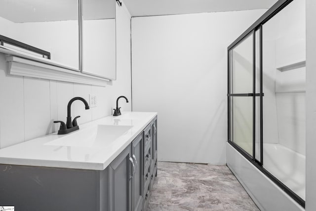 bathroom with bath / shower combo with glass door and vanity