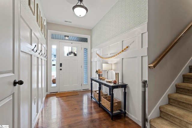 entrance foyer featuring dark hardwood / wood-style flooring