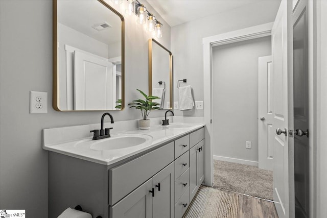 bathroom featuring hardwood / wood-style floors and vanity