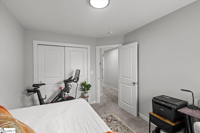 carpeted bedroom featuring a closet