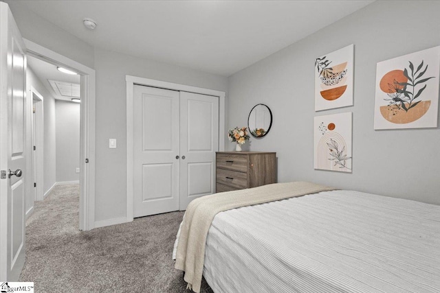 bedroom featuring light carpet and a closet