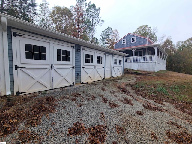 exterior space with a garage and an outdoor structure