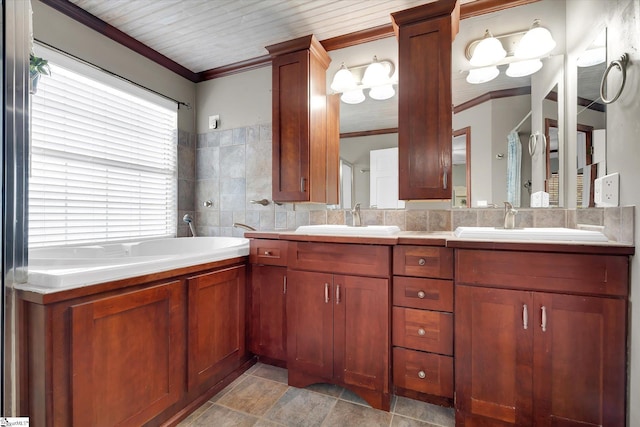 bathroom featuring vanity, ornamental molding, decorative backsplash, and decorative columns