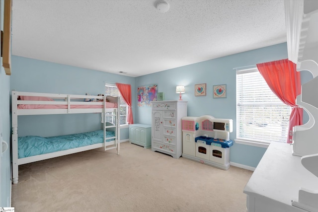 carpeted bedroom with a textured ceiling