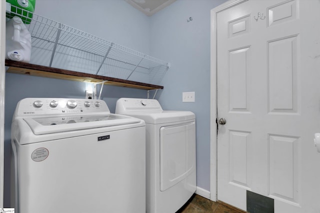 laundry area with separate washer and dryer