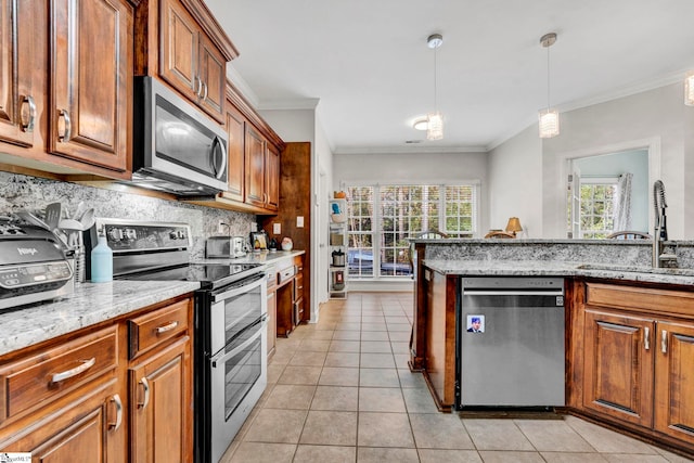 kitchen featuring light tile patterned floors, stainless steel appliances, decorative backsplash, light stone counters, and sink