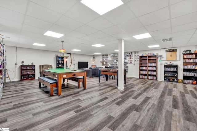 playroom featuring a paneled ceiling and hardwood / wood-style floors