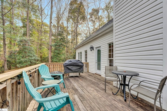 wooden terrace featuring area for grilling