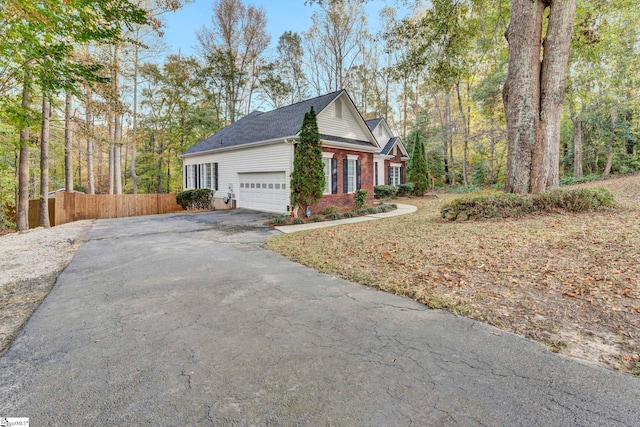 view of side of property with a garage