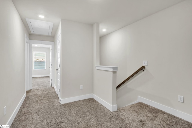 corridor with light colored carpet