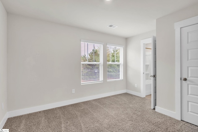 empty room featuring carpet floors