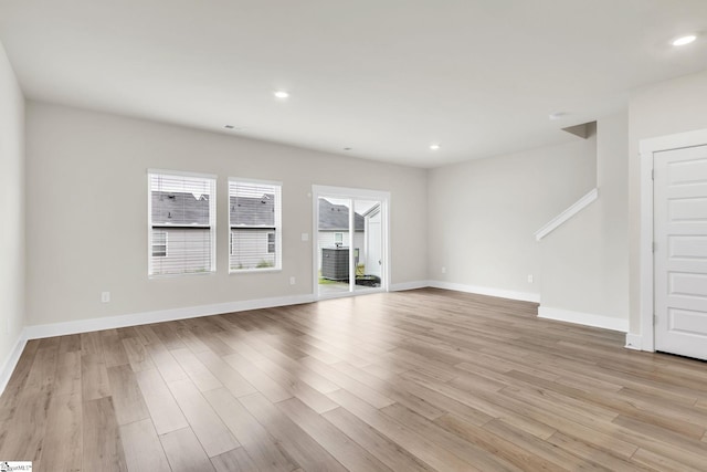 unfurnished living room featuring light hardwood / wood-style flooring