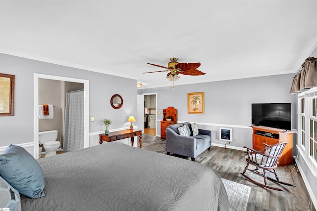 bedroom featuring connected bathroom, hardwood / wood-style floors, ceiling fan, and crown molding