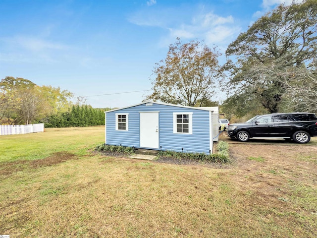 view of outdoor structure with a yard