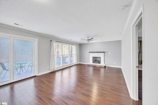 unfurnished living room featuring ornamental molding, dark hardwood / wood-style floors, and a fireplace