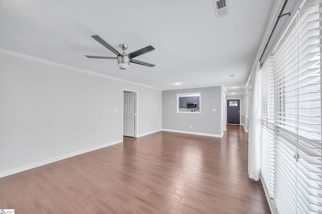 unfurnished living room with ornamental molding, dark hardwood / wood-style flooring, a textured ceiling, and ceiling fan