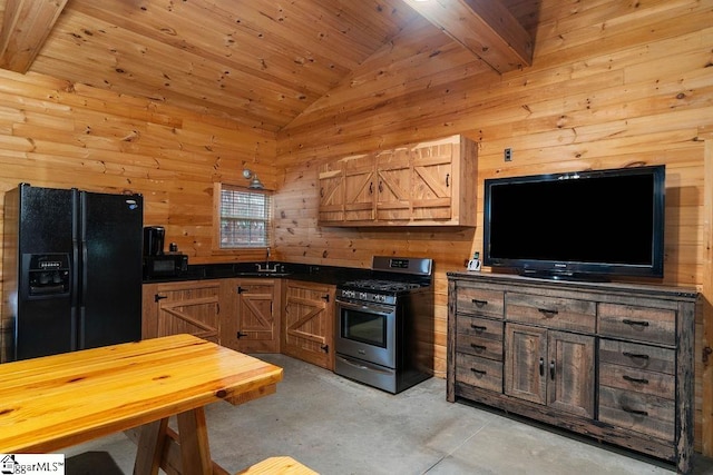 kitchen with beamed ceiling, black appliances, wooden walls, and wood ceiling