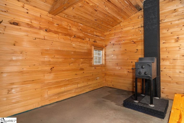 interior space with wooden ceiling, wooden walls, and lofted ceiling