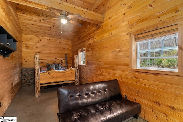 bedroom with ceiling fan, multiple windows, wooden walls, and vaulted ceiling with beams