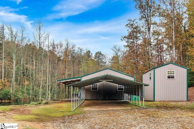 view of outbuilding featuring a carport