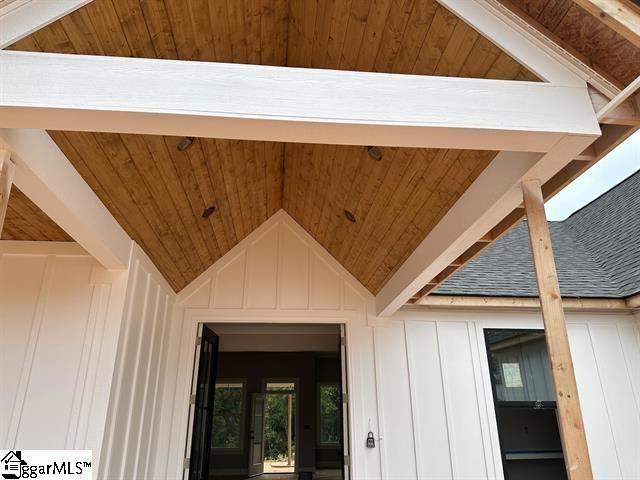 details with wood ceiling and beam ceiling