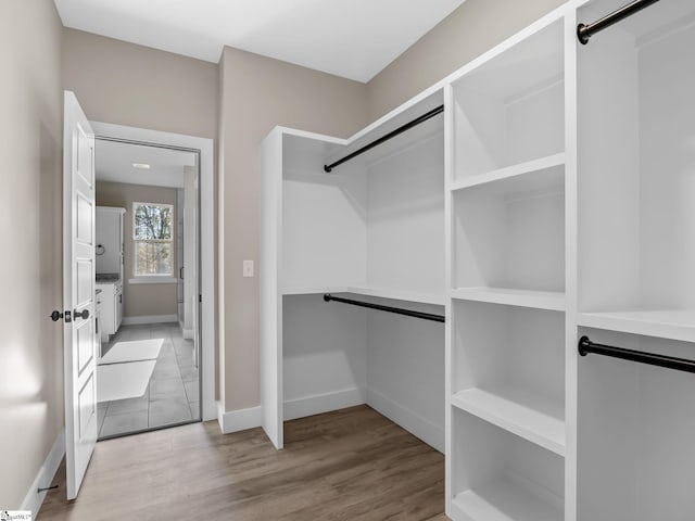 walk in closet featuring light hardwood / wood-style floors