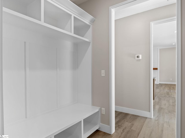 mudroom with light hardwood / wood-style flooring