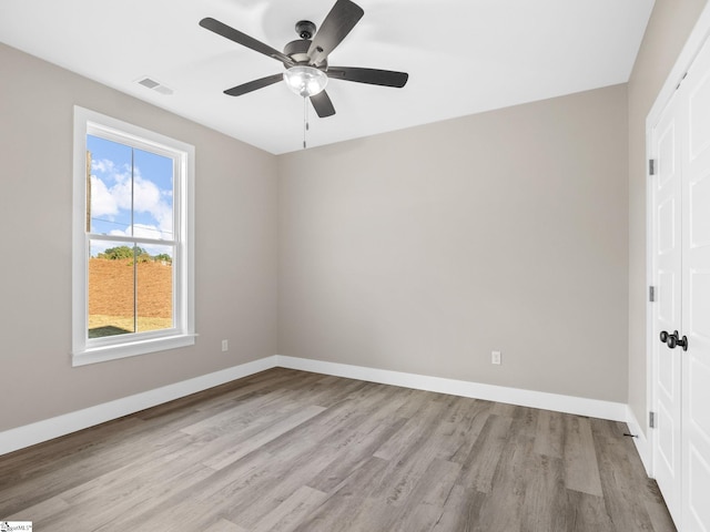 spare room featuring ceiling fan and light wood-type flooring