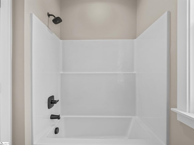 bathroom with shower / washtub combination