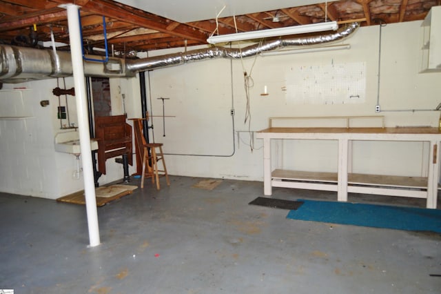 basement featuring a baseboard heating unit