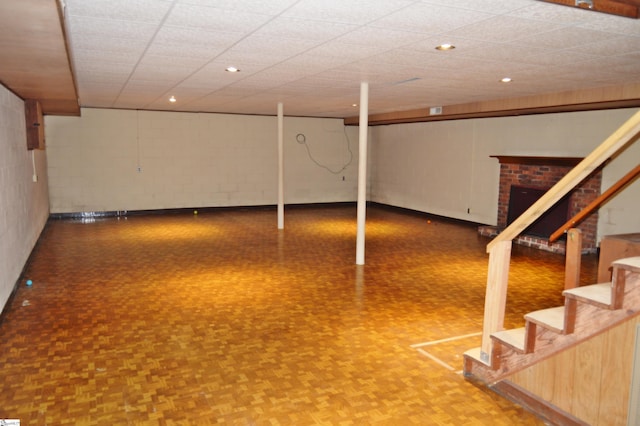 basement featuring parquet flooring