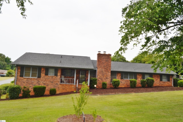 ranch-style home with a front yard