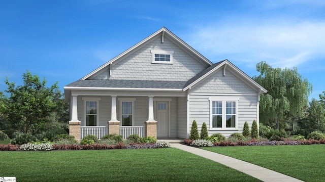 craftsman house featuring a front lawn and covered porch