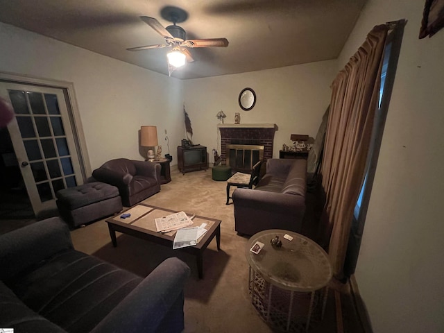 living room with carpet flooring, ceiling fan, and a brick fireplace