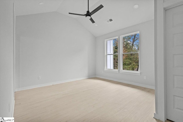 unfurnished room featuring ceiling fan, light hardwood / wood-style floors, and vaulted ceiling