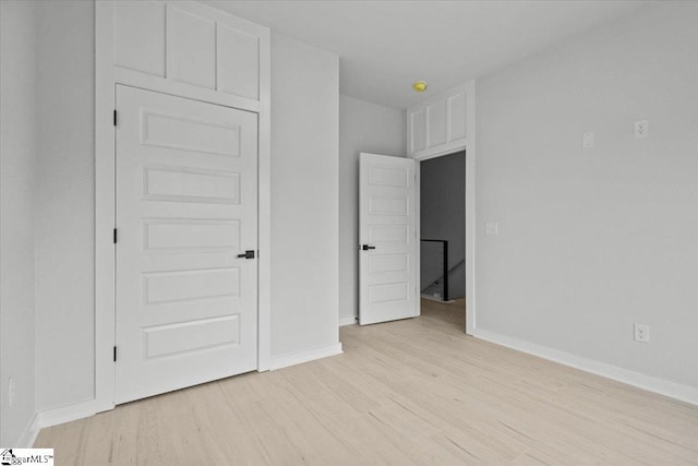 unfurnished bedroom featuring light hardwood / wood-style floors