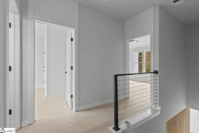 hall with light hardwood / wood-style flooring