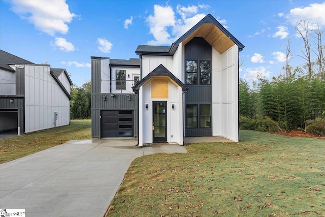view of front facade with a front lawn and a garage