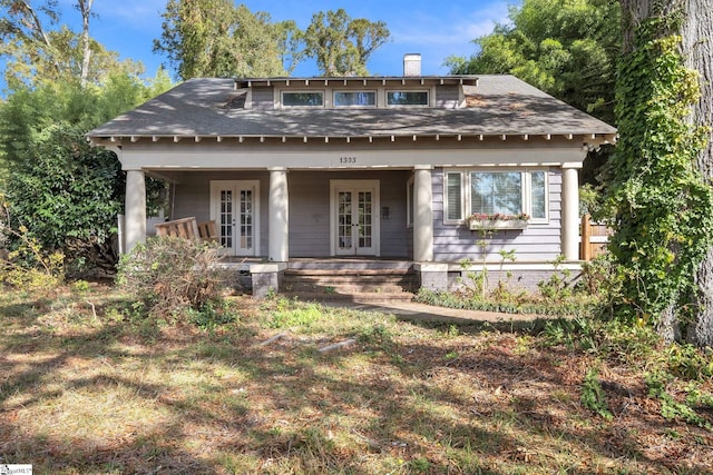 1303 E River St, Anderson, SC 29624 - view of front of home featuring french doors, a chimney, roof with shingles, and covered porch