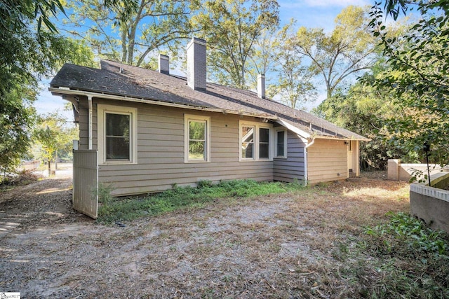 1303 E River St, Anderson, SC 29624 - back of property featuring a chimney and roof with shingles