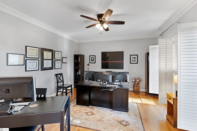 home office with ornamental molding, light wood-type flooring, and ceiling fan